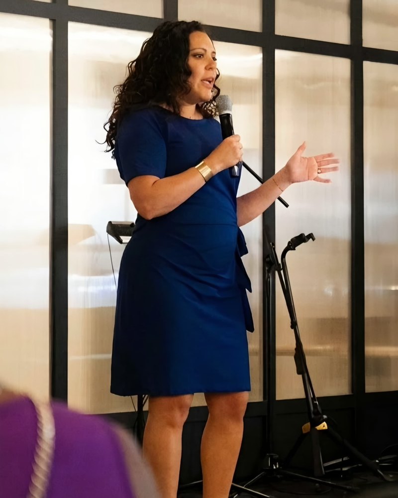 Jennifer Reyes speaking on stage